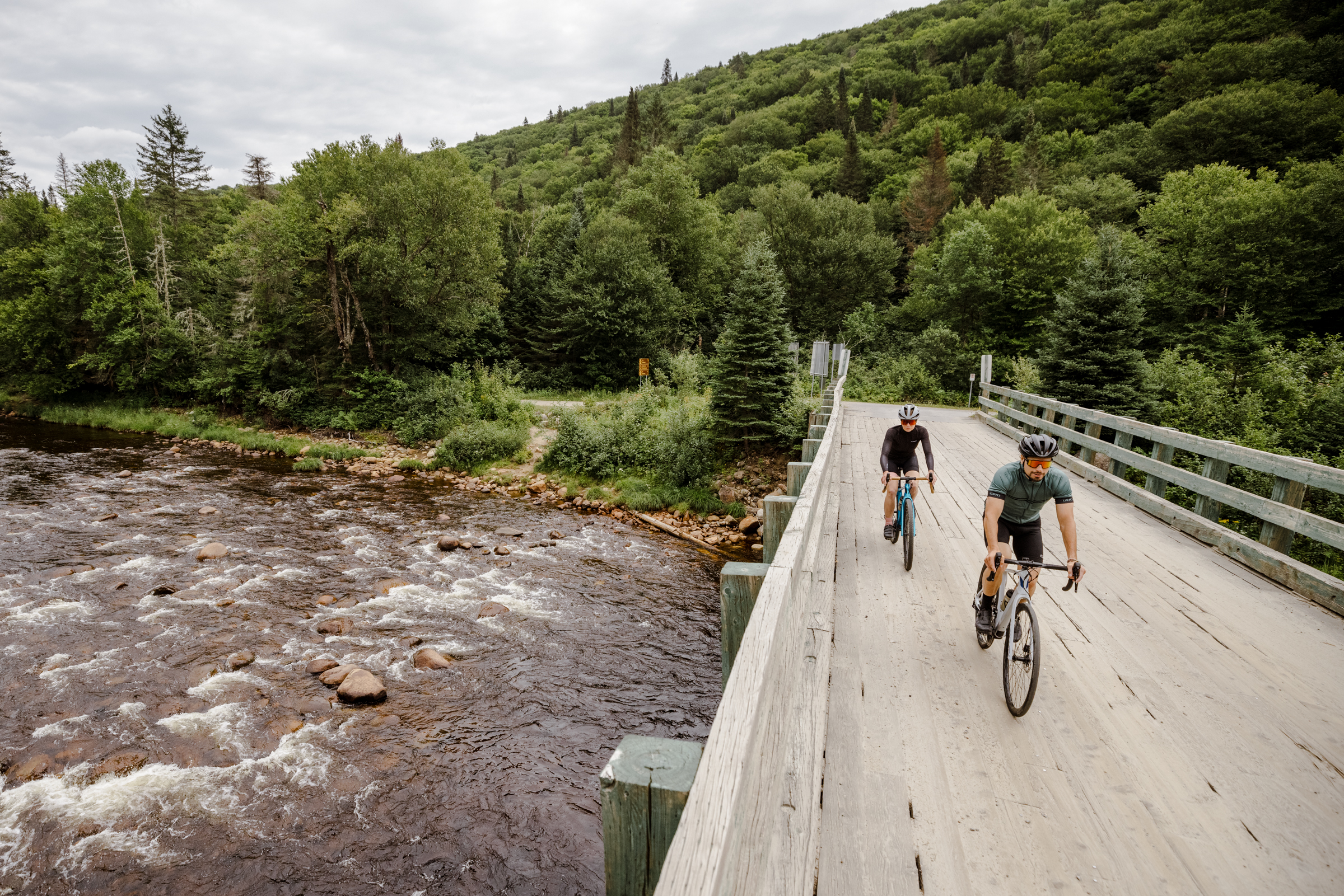 Devinci Hatchet R-Spec and G-Spec riding on a bridge