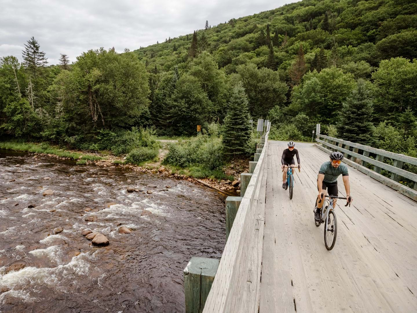 Devinci Hatchet R-Spec and G-Spec riding on a bridge