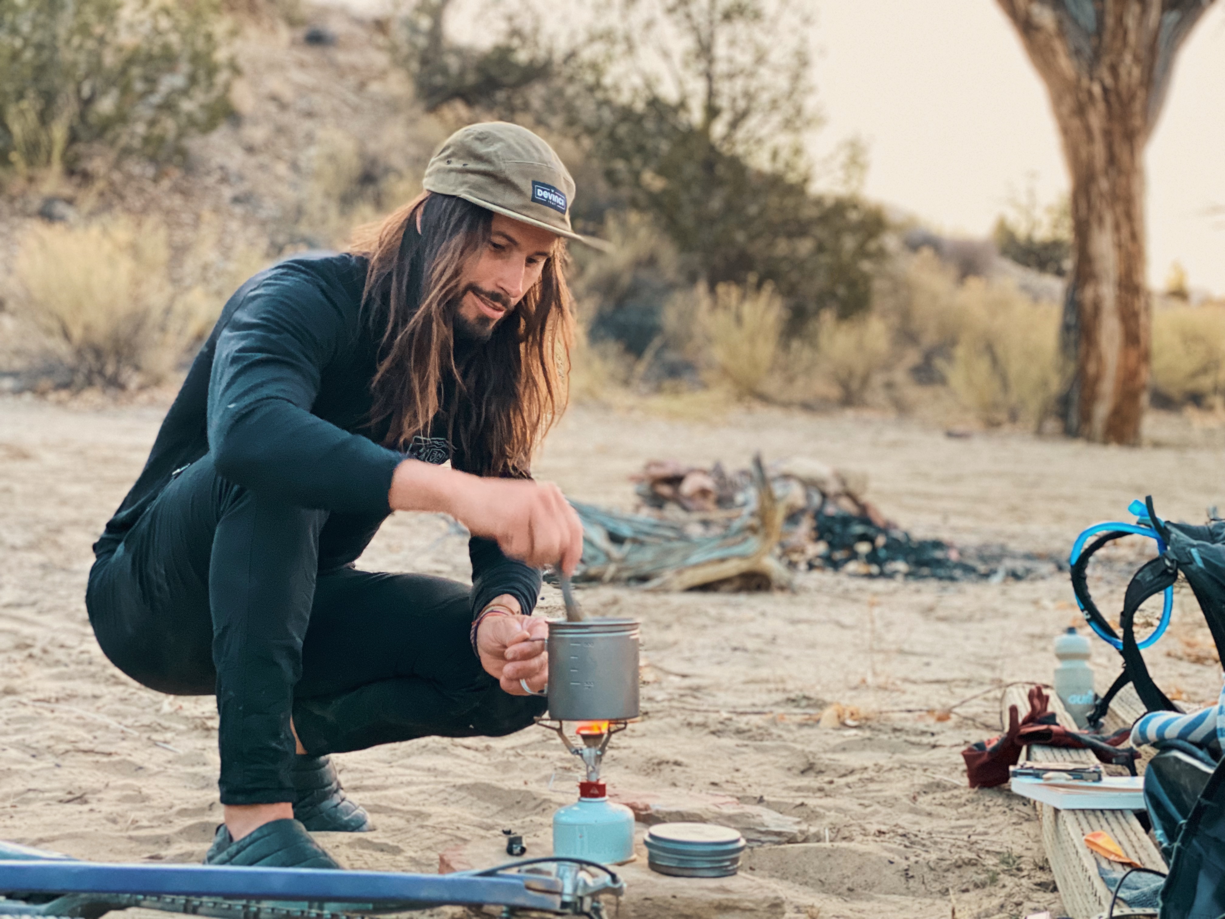 Preparing dinner while bikepacking in the desert