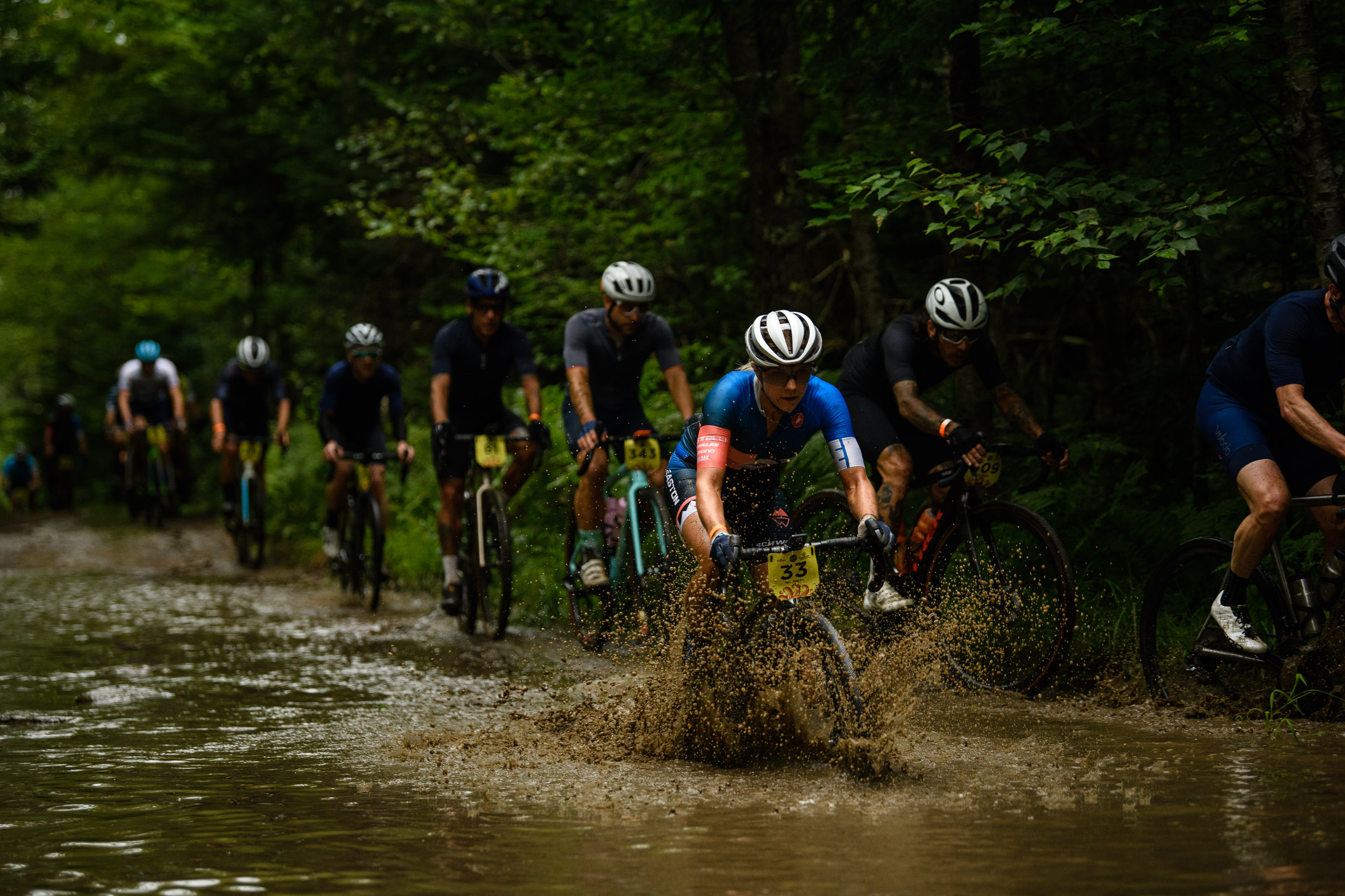 Caitlin Bernstein racing her Devinci Carbon Hatchet in mud 