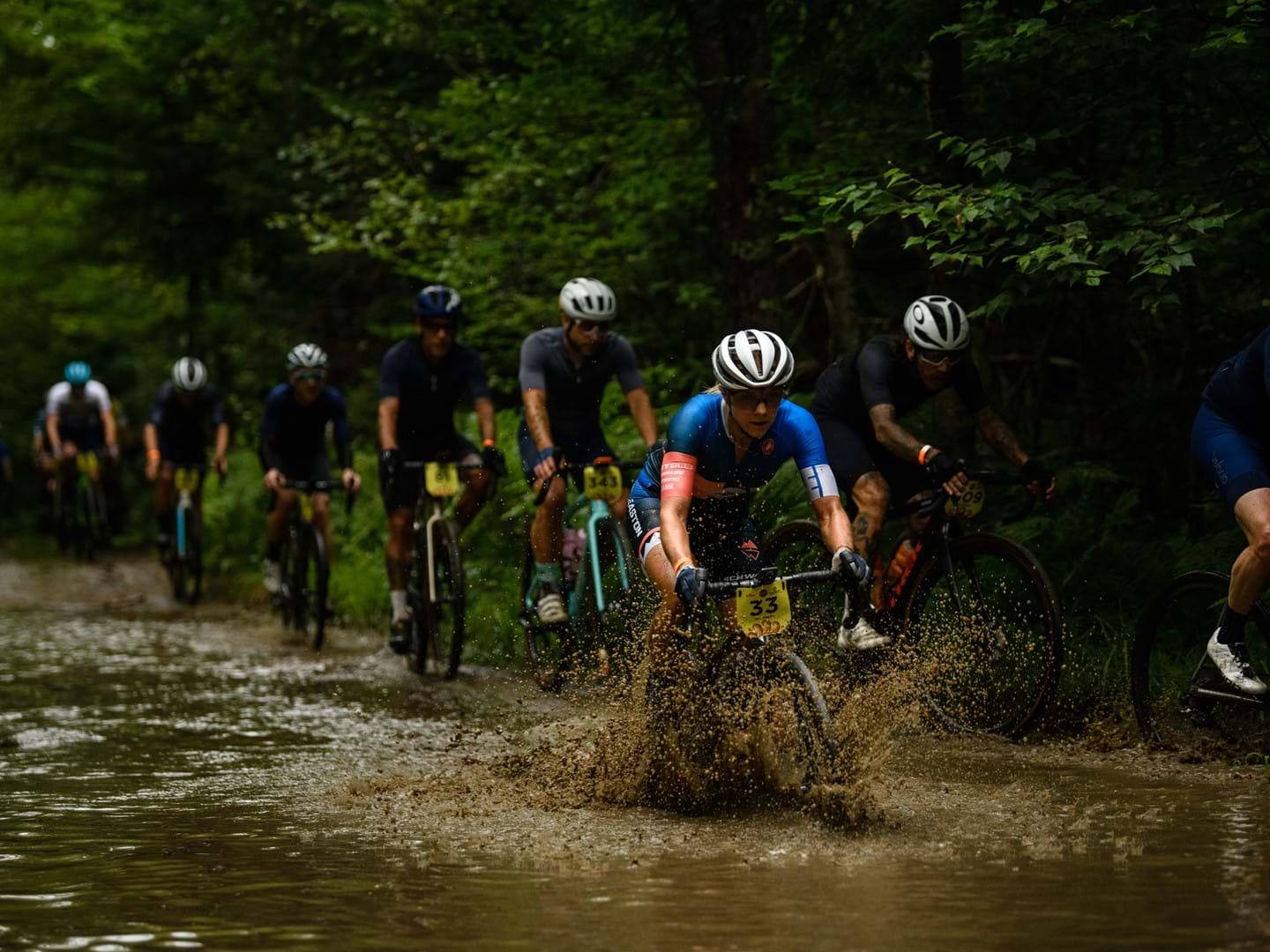 Caitlin Bernstein racing her Devinci Carbon Hatchet in mud 