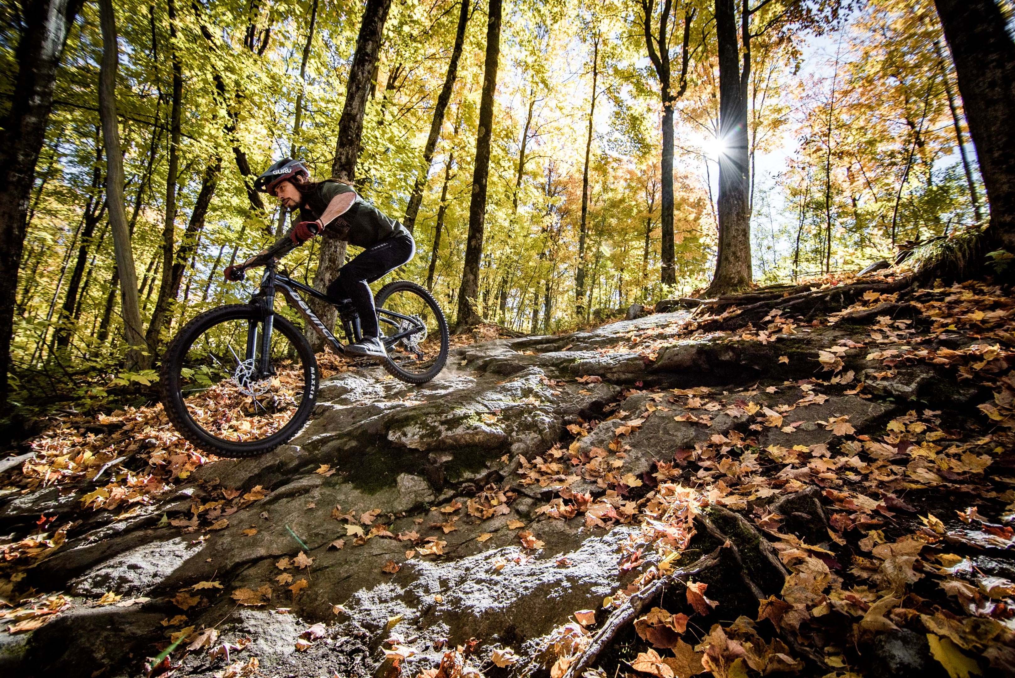 riding down a rock garden on a devinci marshall
